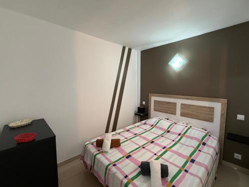 a bedroom with a bed and a table and a light at AwayDays - Apartamento en la 7a planta vista mar! in Empuriabrava