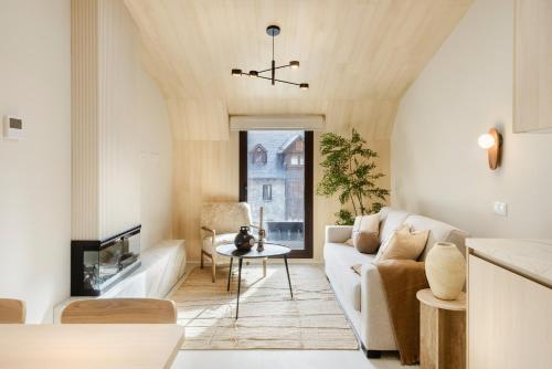 a living room with a couch and a table at CiMa Panticosa by BeValle in Panticosa