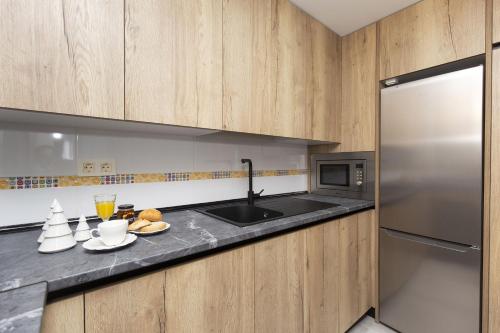 a kitchen with a sink and a counter top at Casa Lite by BeValle in Escarrilla