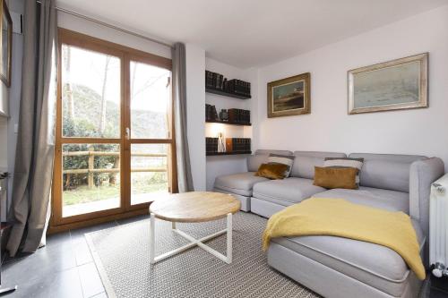 a living room with a couch and a table at Casa Vity by BeValle in Panticosa