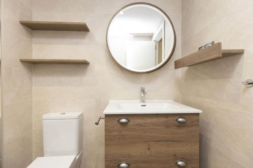 a bathroom with a sink and a mirror at Montibel by BeValle in Panticosa