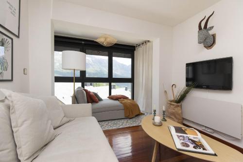 a living room with a couch and a table at Partacua by BeValle in Tramacastilla de Tena