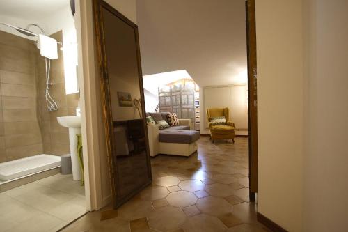 a bathroom with a sink and a tub in a room at Stanza del Cerro in Aranova