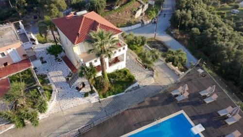 an overhead view of a house and a swimming pool at Diogenis Parga Studios in Parga