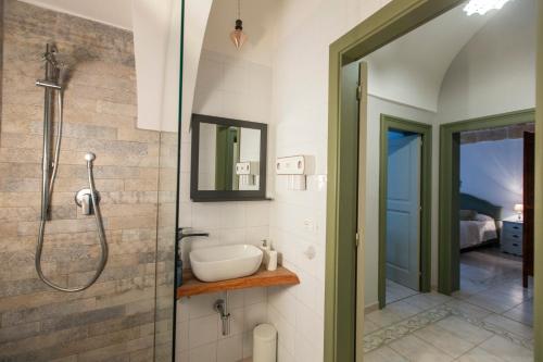 a bathroom with a shower and a sink at Nel Blu Dipinto di Blu - Casa Anemone in Polignano a Mare