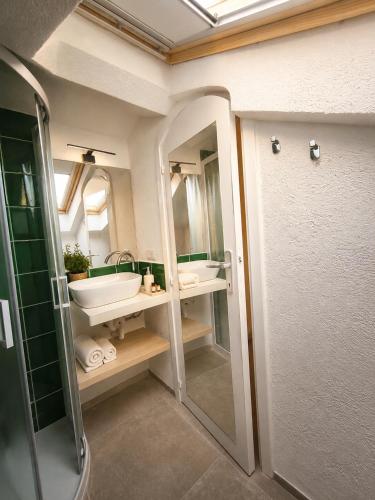 a bathroom with a sink and a mirror at NEW 2026 - Villa Rafael in Porto Rafael