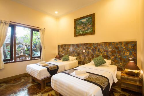 Postel nebo postele na pokoji v ubytování Bulan Bali Homestay