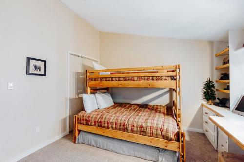 a bedroom with a bunk bed in a room at Mountain Breeze in Breckenridge