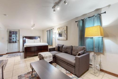 a living room with a couch and a bed at Eagles Nest in Vail