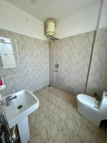 a bathroom with a sink and a toilet at Laksh hotel,Proprietor Dilbag in Kurukshetra