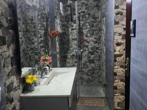 a bathroom with a sink and a shower at Villa khaddouj Marrakech in Marrakesh