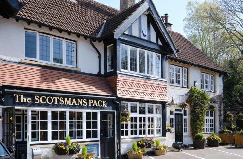 a building with a sign that reads the scotsmans pack at Scotsman's Pack Hotel in Hathersage