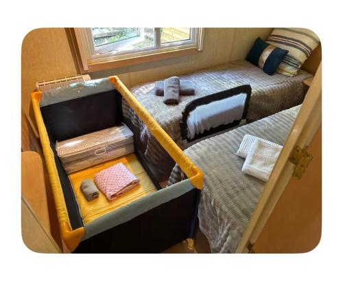 a small room with a bunk bed and a twin bed at Gite de la colline des rois in Verlin