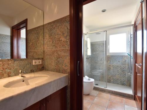 a bathroom with a sink and a shower at Amaya in Begur