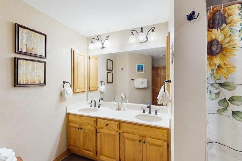 a bathroom with a sink and a mirror at Cascade 347 in Durango Mountain Resort
