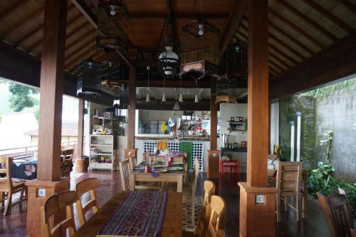 a dining room with a table and chairs at Manggis Garden Dive Resort in Candidasa