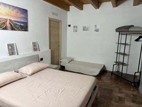 a bedroom with two beds in a room at La Torre a colori in Esine