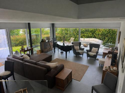 a living room with a couch and chairs and a table at Montebello in Bellinzona