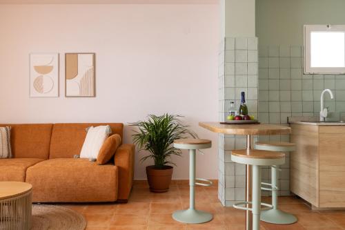 a living room with a couch and a table at The Loft House Ibiza in Santa Eularia des Riu