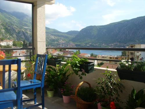 a balcony with a view of the water and mountains at Apartments Dakovic in Kotor