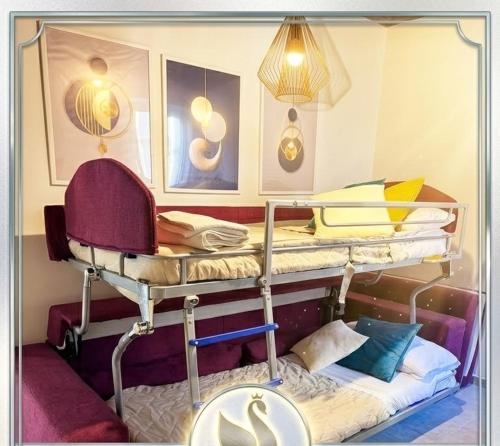a room with two bunk beds and a chair at Casa del Cigno in Monterotondo