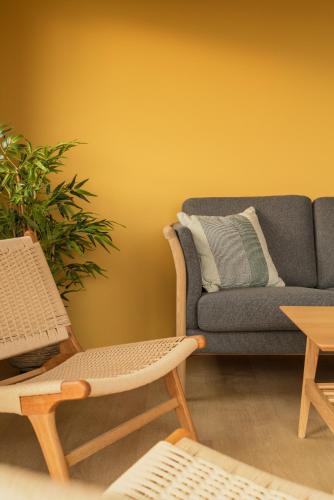 a living room with a couch and a table at Á Varða Apartments in Tórshavn