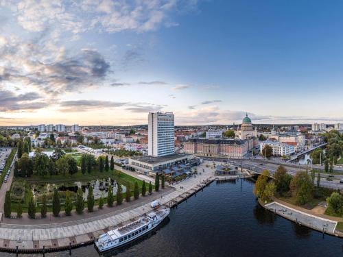 an aerial view of a city with a river at Mercure Hotel Potsdam City in Potsdam