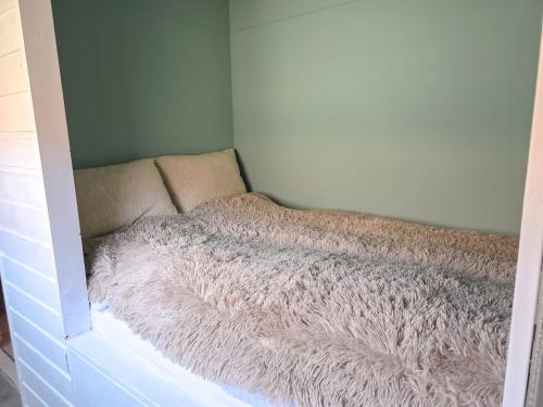 a dog bed in a corner of a room at Vakantiewoning La Luna OK42 in Oostkapelle