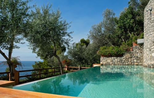 a swimming pool with a view of the ocean at Villa Corallium in Praiano