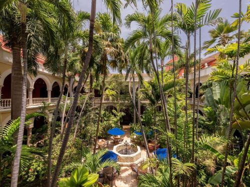 an aerial view of a resort with palm trees at Sofitel Legend Santa Clara Cartagena in Cartagena de Indias