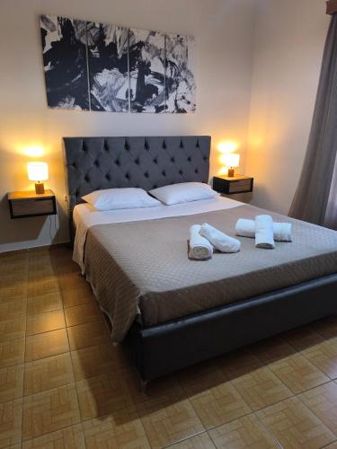 a bedroom with a bed with two towels on it at Sonata apartment in Argostoli