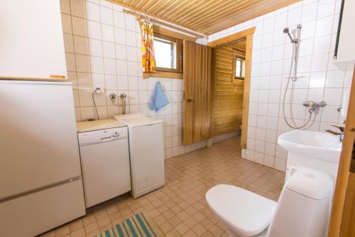 a bathroom with a toilet and a sink at Villa Hauki, Puruvesi Lakeside by Naaranlahti in Naaranlahti
