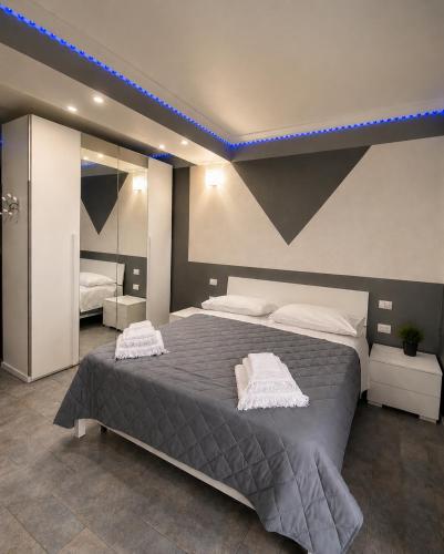 a bedroom with a large bed with two towels on it at Bellavista B&B in Roccavivara