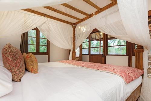 Postel nebo postele na pokoji v ubytování Villa Luna Sunset Beach