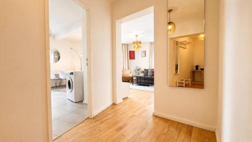 an open hallway with a kitchen and a living room at URBAN FLATS Berlin in Berlin