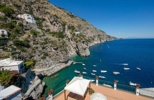a view of the amalfi coast with boats in the water at Villa Corallium in Praiano