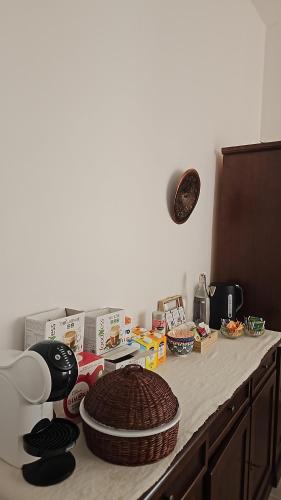 a kitchen counter with boxes and food on it at B&B Le Fontane in Bono