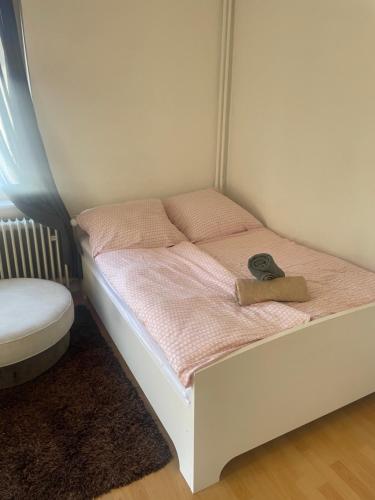 a small bed with a shoe sitting on top of it at Smart in Bad Pyrmont