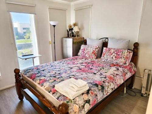 a bedroom with a bed with a quilt on it at Room in Officer in Officer