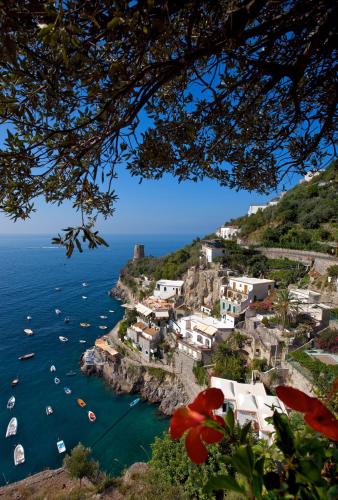 a view of the amalfi coast with boats in the water at Villa Corallium in Praiano