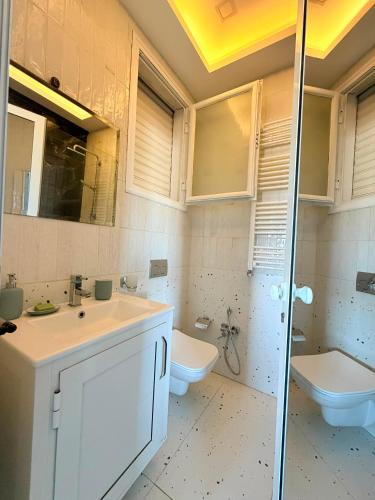a bathroom with a sink and a toilet at Emeraude in Tunis
