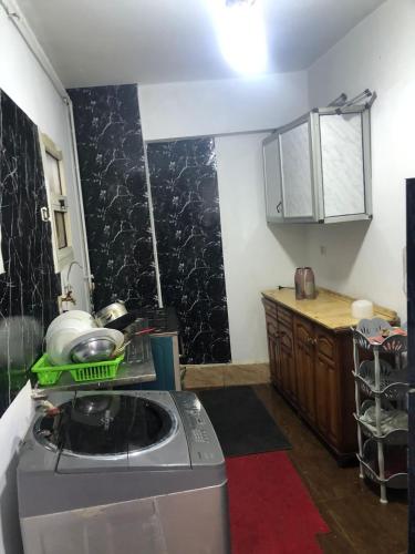 a kitchen with a washing machine and a counter at مقاولين العرب in Cairo