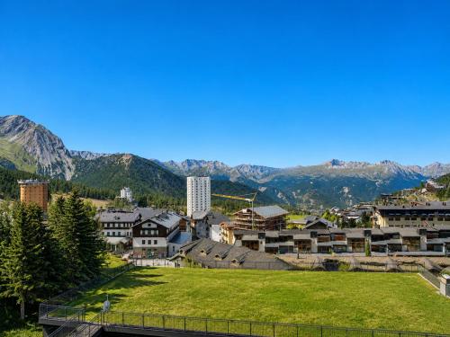 a view of a town with mountains in the background at Hostdomus - Royal View in Sestriere