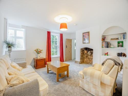 a living room with a couch and a table at Misdale House in Louth