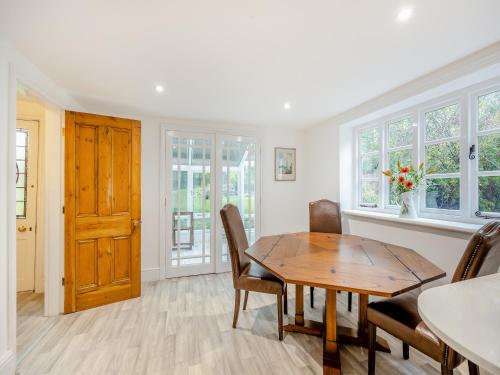 a dining room with a wooden table and chairs at Misdale House in Louth