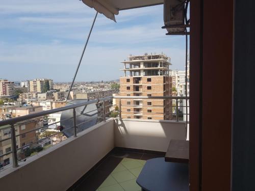 a balcony with a view of a city at Familja Kapaj in Polisi i Vogël