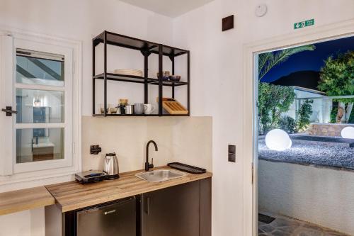 a kitchen with a sink and a window at Βlue Lagoon G6 in Galissas