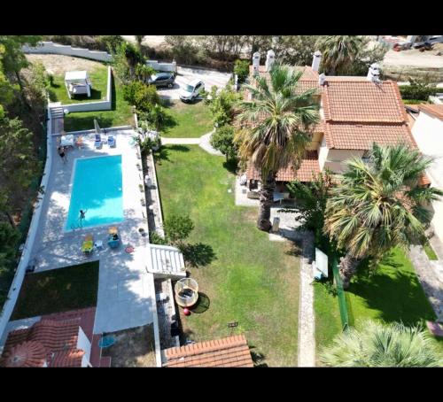 an aerial view of a house with a swimming pool at Posidi pool apartment in Possidi