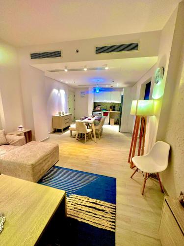 a large living room with a couch and a table at Fouka bay service appartment FOR Families only in Marsa Matruh
