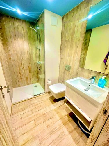 a bathroom with a sink and a shower and a toilet at Fouka bay service appartment FOR Families only in Marsa Matruh